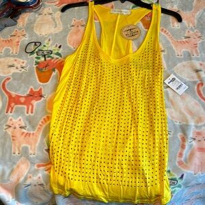 Pretty yellow tank top with studs never worn